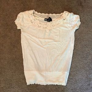 INC cream colored top in XS.